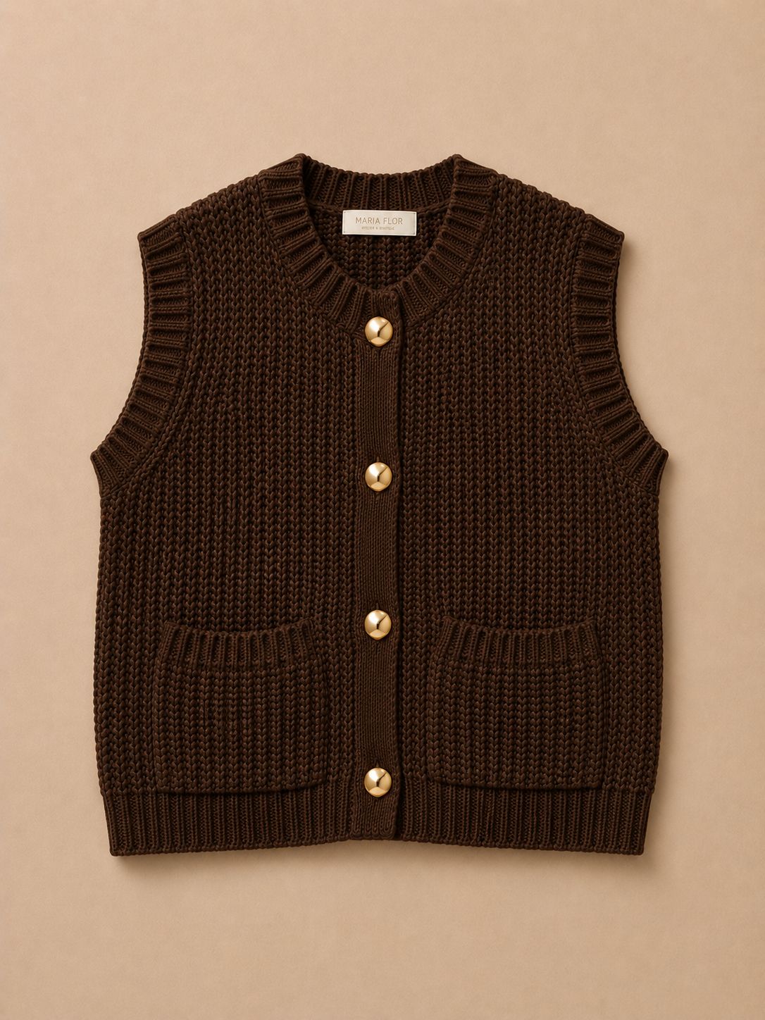 Brown knitted vest with gold buttons on a beige background